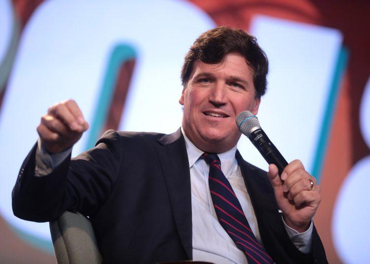 Tucker Carlson speaking with attendees at the 2018 Student Action Summit hosted by Turning Point USA in West Palm Beach, Fla.