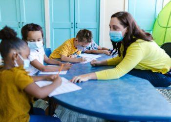 teacher teaching her students
