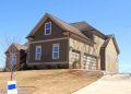 brown and beige wooden house under blue sky