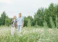 elderly couple walking on a flower field