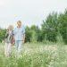 elderly couple walking on a flower field