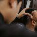 selective focus photography of a barber